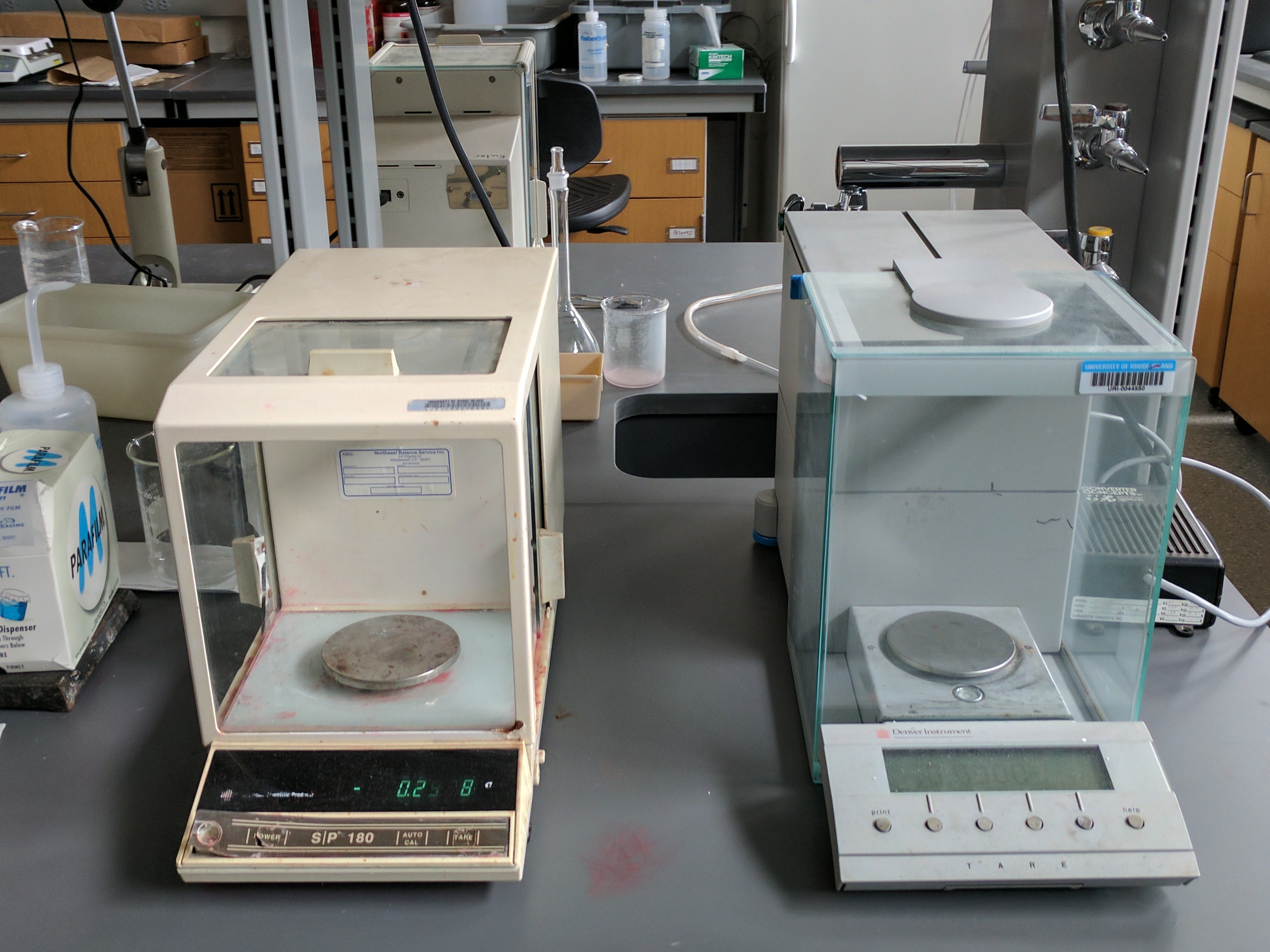 Analytical Balances: Both 4-place (left) and 5-place (right) analytical balances are used in the lab.