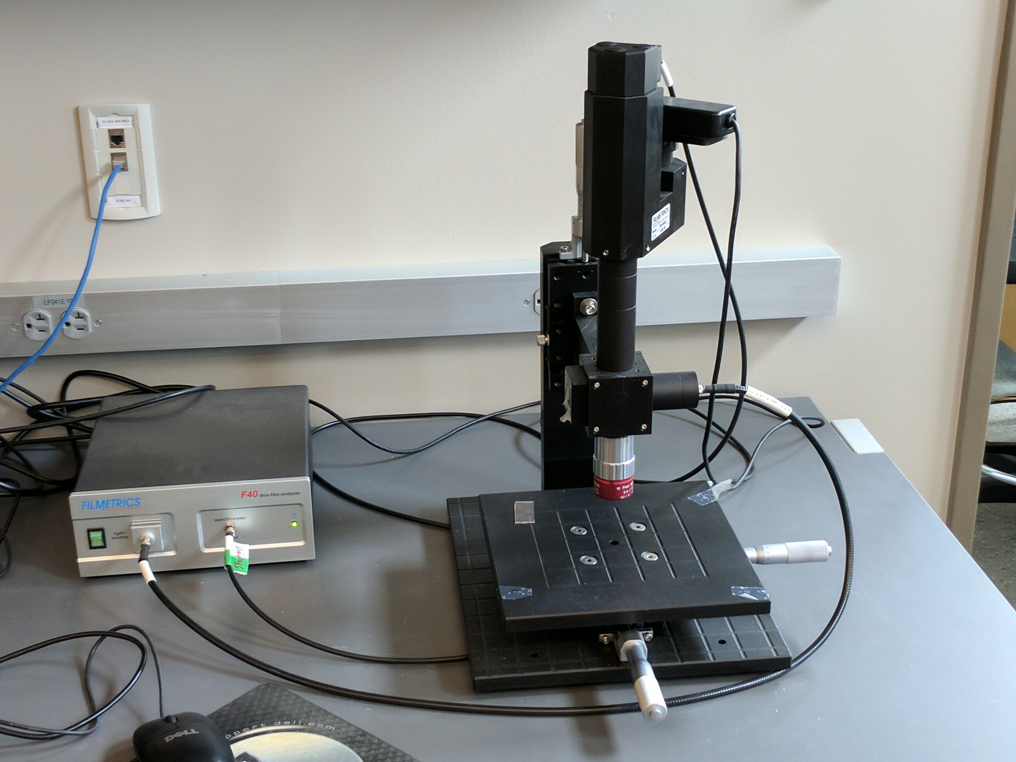 Filmetrics Thin Film Analyzer: The thin film analyzer measures the reflectance spectrum of the sample and can be used to determine the thickness of coatings. Under ideal circumstances, the thickness of several layers can be determined concurrently. 