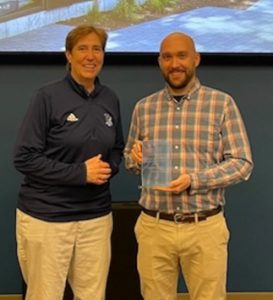 Photo of Prof. Dugan Hayes and Dean Riley with award plaque 